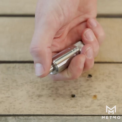 metmo piston - stainless steel air bearing fidget toy, video shows hand fidgeting with the toy