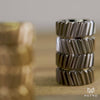 Titanium and brass helicos in the background and foreground respectively, shifting focus