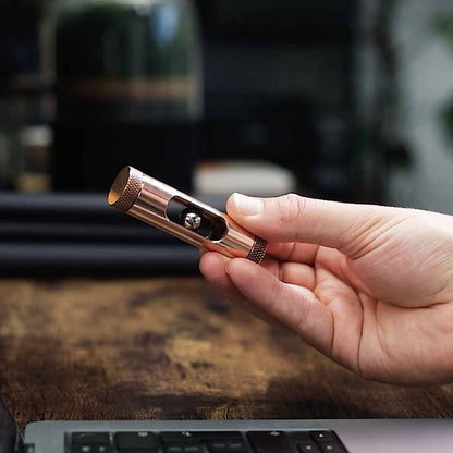 Metmo Eddy science desk toy showing a magnetic ball falling through the copper tube, creating an eddy current 