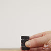 Nylon helico magnet flip trick on white background