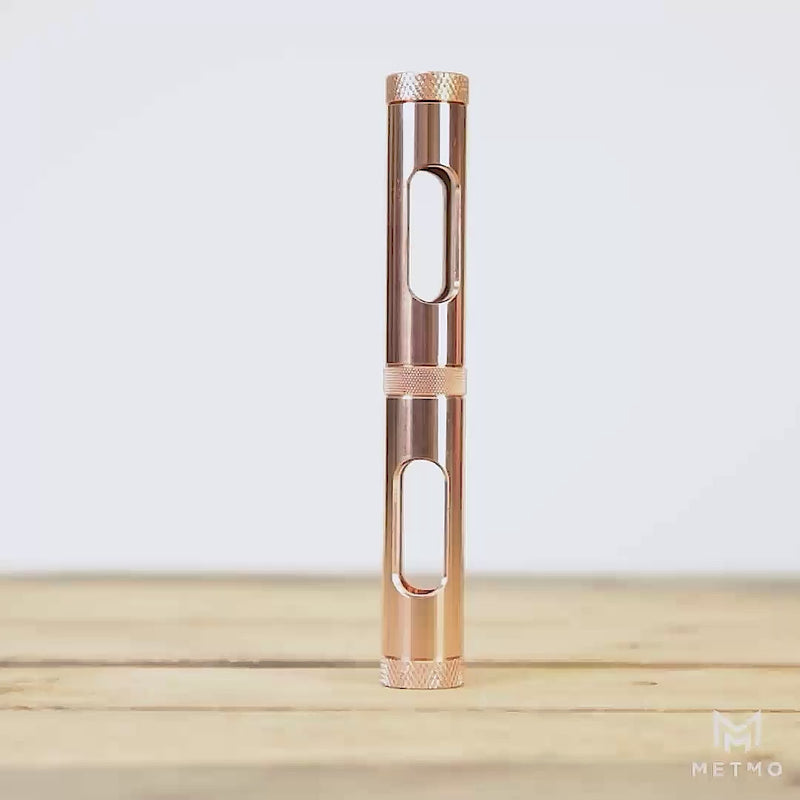 Metmo Eddy science desk toy showing a magnetic ball falling through the copper tube, creating an eddy current 