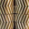 Zoomed in view of a brass helico fidget toy showing close up of interlocking spinning gears
