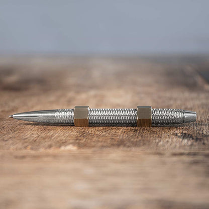 MetMo Aluminium Dual threaded Pen with Brass Nuts on a desk
